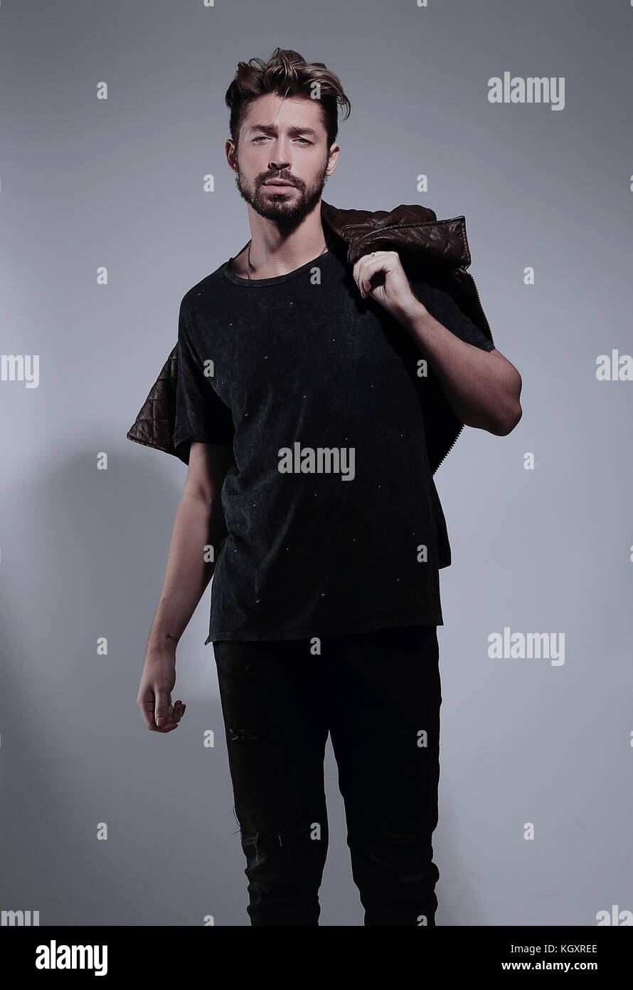 Portrait of a pensive handsome man over gray background Stock Photo - Alamy