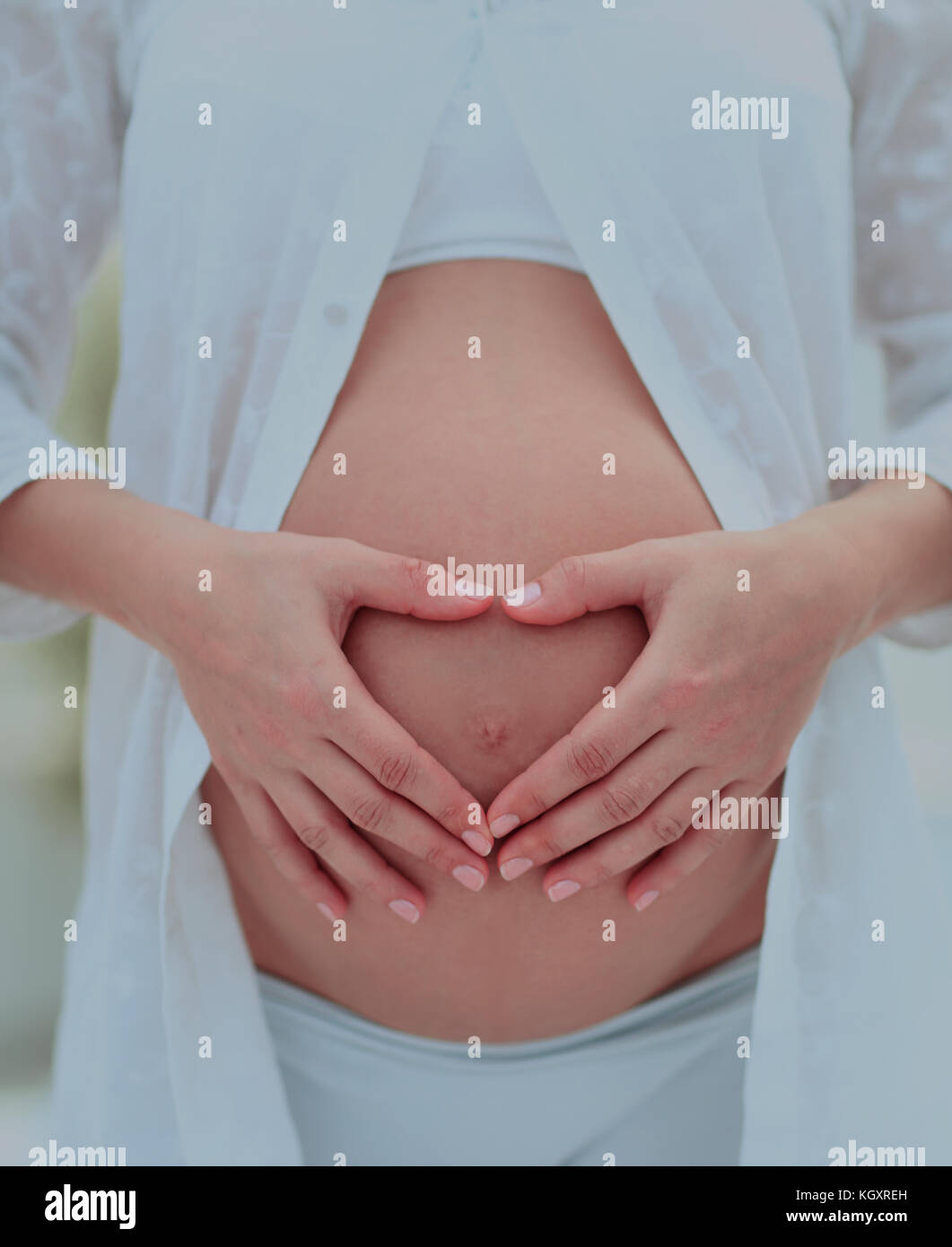 Woman pregnant belly touch hi-res stock photography and images