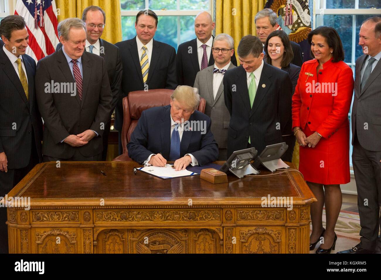 U.S. President Donald Trump signs H.J. Res.111 - the Disapproving of the Consumer Financial Protection Bureaus Arbitration Agreement Rule into a law in the White House Oval Office November 1, 2017 in Washington, DC.  (photo by Joyce N. Boghosian via Planetpix) Stock Photo
