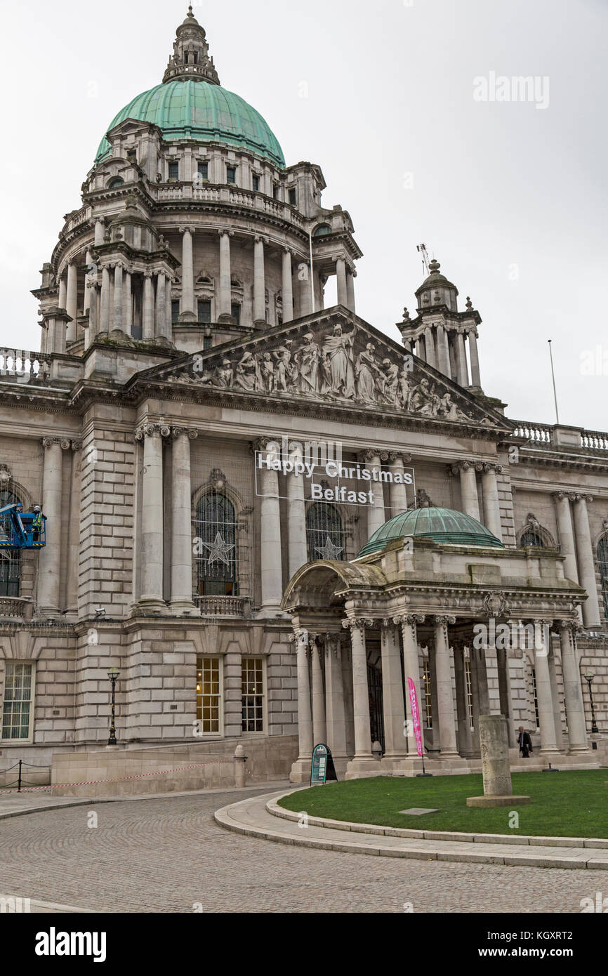 Front of City Hall Belfast, showing the sign Happy Christmas Belfast above the main entrance. Stock Photo