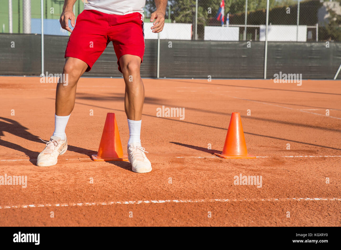Professional tennis player warming up by dodging cones in zigzag manner Stock Photo Alamy