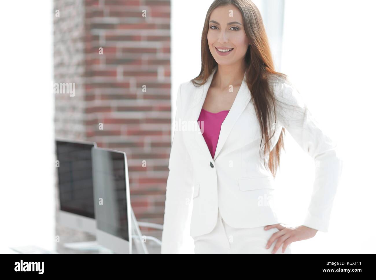 elegant business woman in a white business suit Stock Photo - Alamy