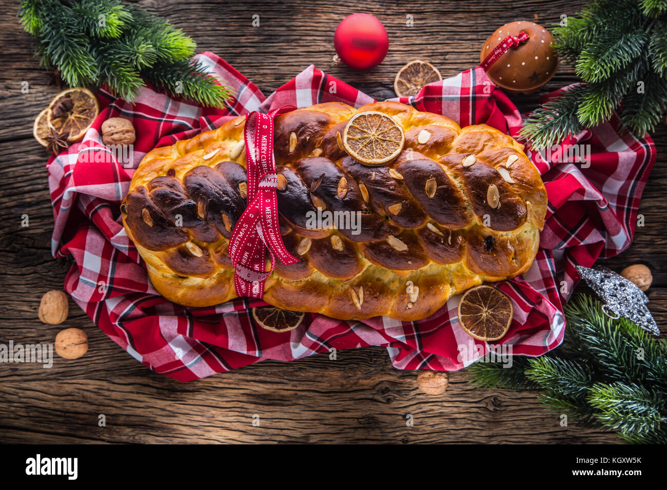 Christmas Cake and Christmas Decorations. Christmas cake, slovak or eastern europe traditional pastry - vianocka. Stock Photo
