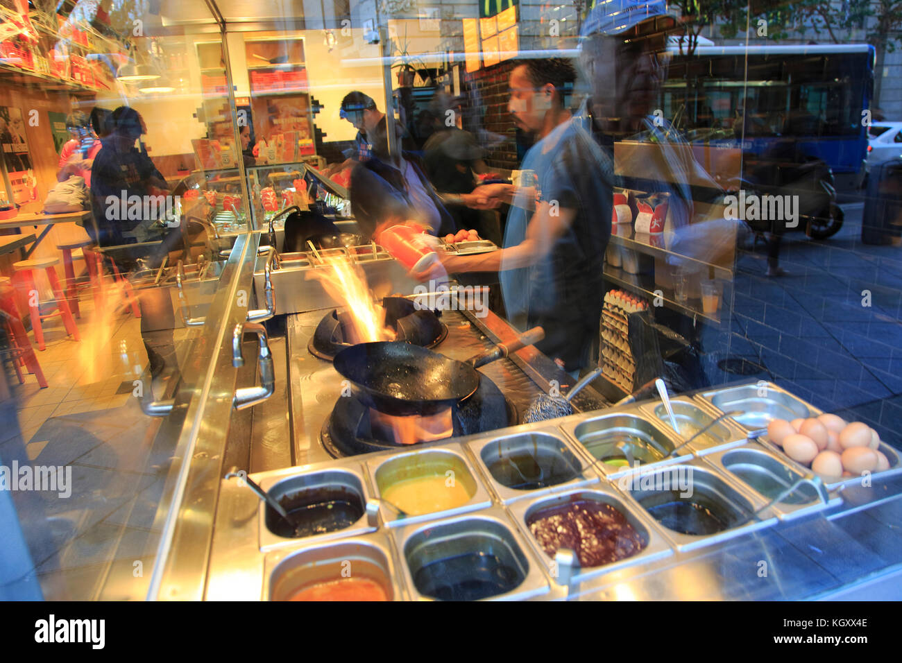Show cooking fast food wok display at restaurant, Wok to Walk, Calle Mayor,  Madrid, Spain Stock Photo - Alamy