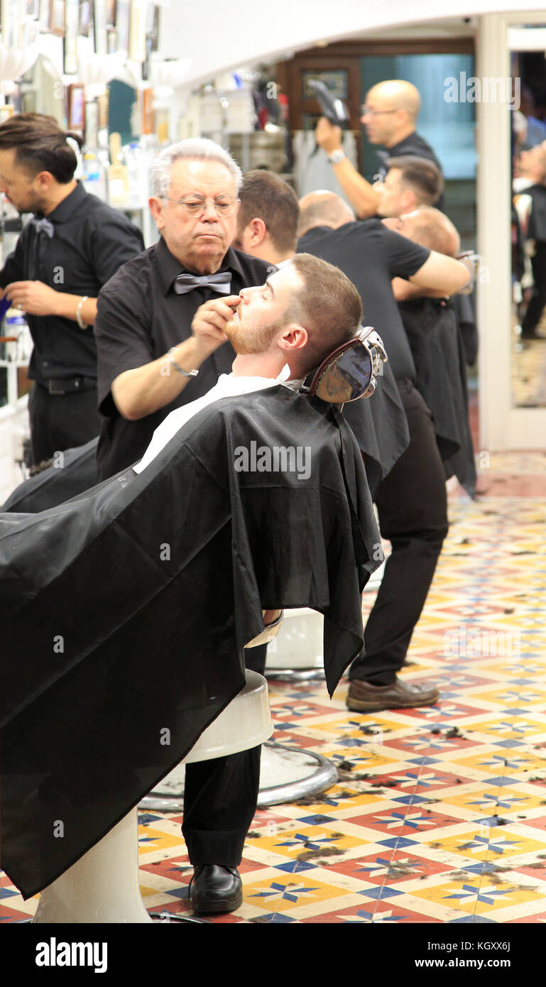 Traditional barber shop customer being shaved, El Kinze de Cuchilleros