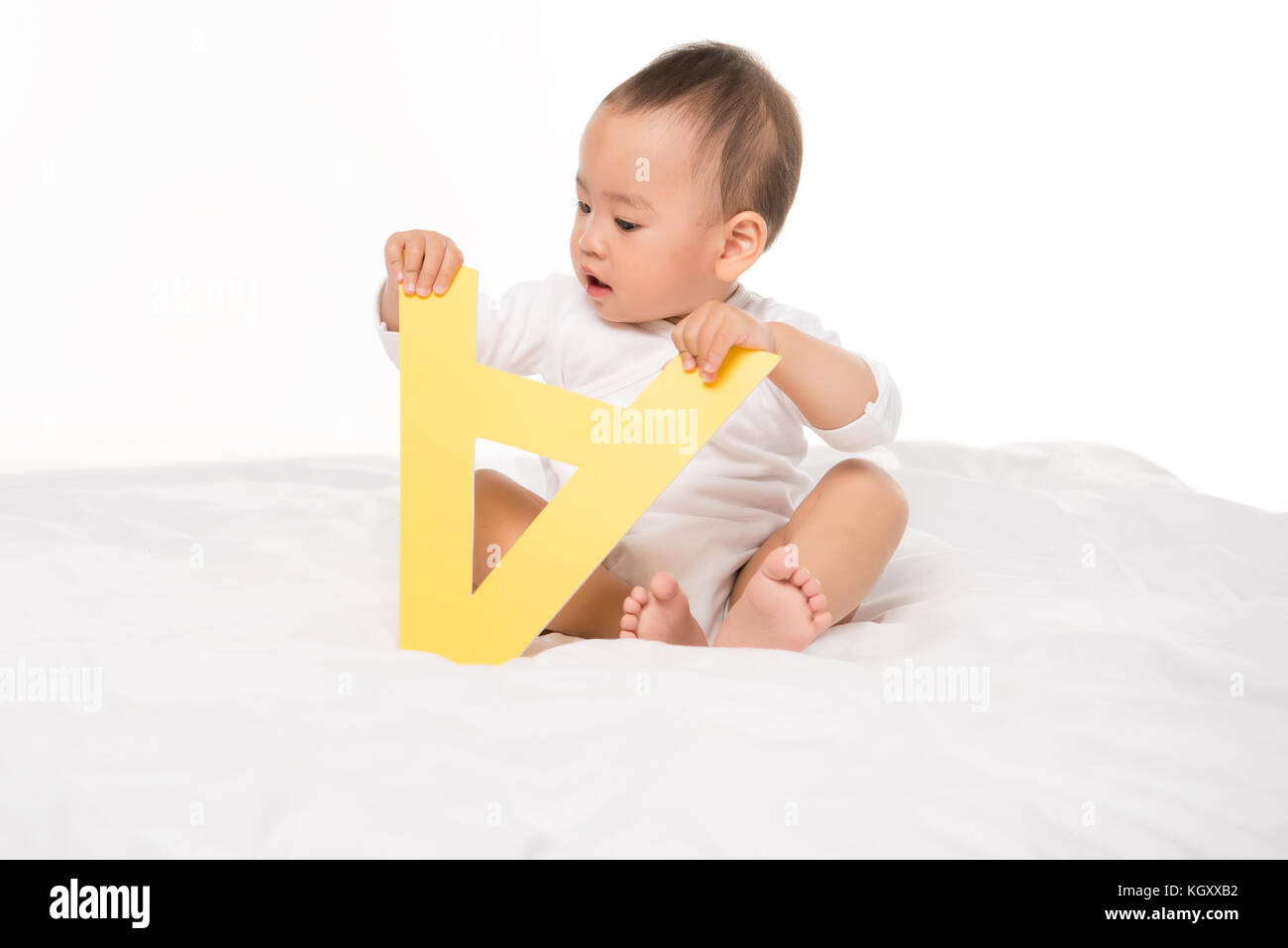 asian toddler boy with paper letter Stock Photo