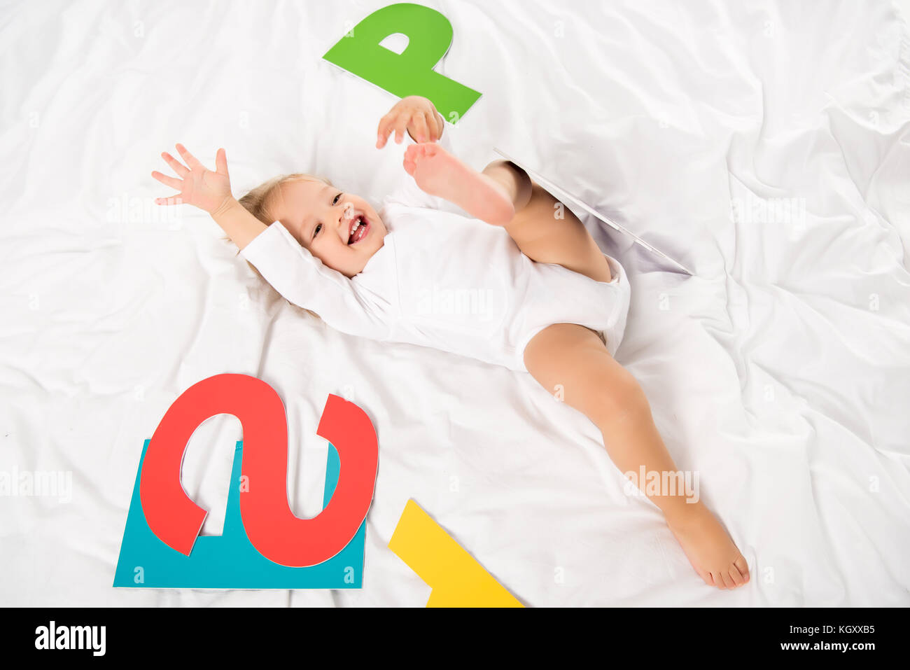happy baby with paper letters Stock Photo - Alamy