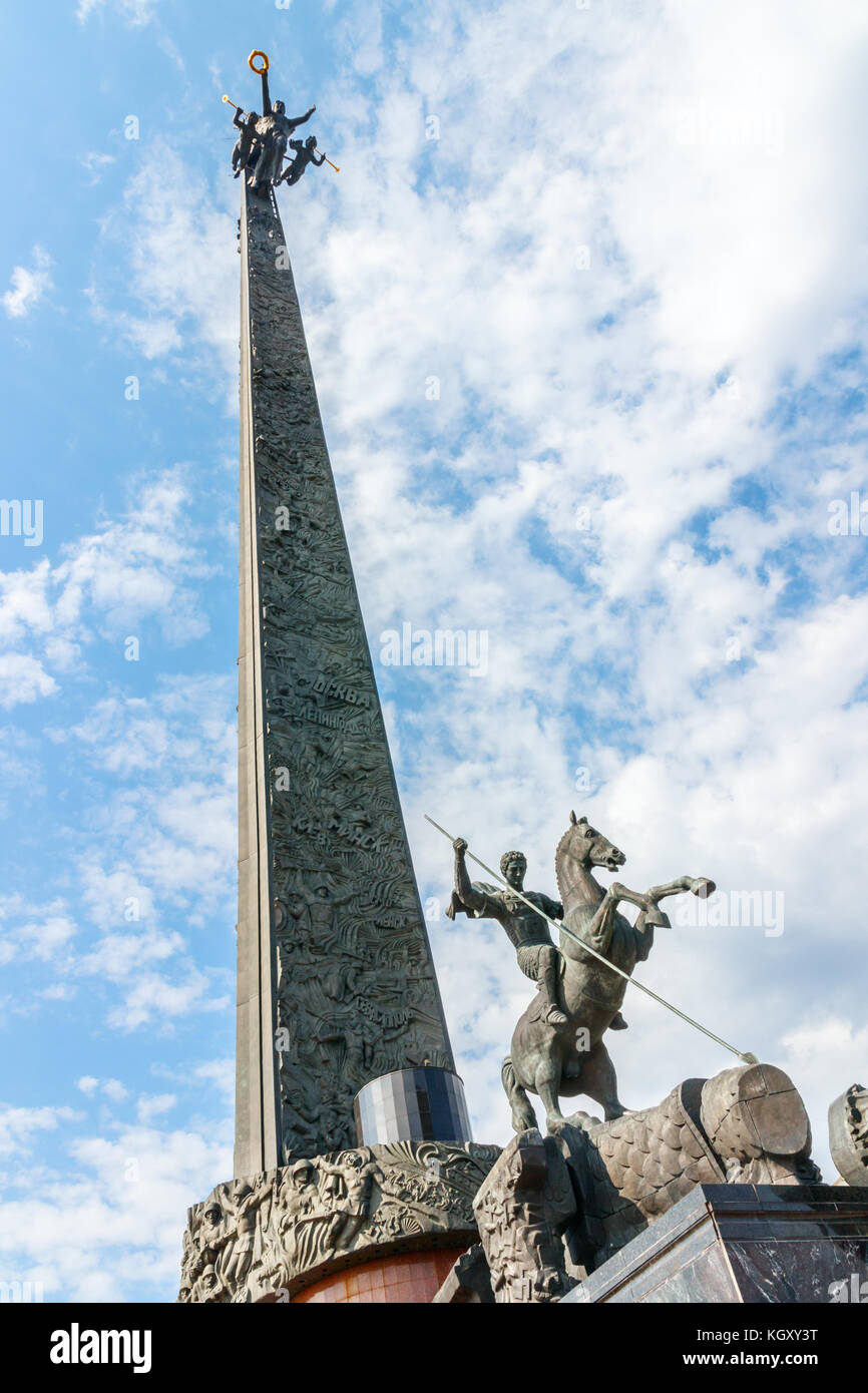 The 141.8 m. tall Obelisk with bronze sculptures at the Poklonnaya Hill Victory Park. Moscow, Russia. Stock Photo