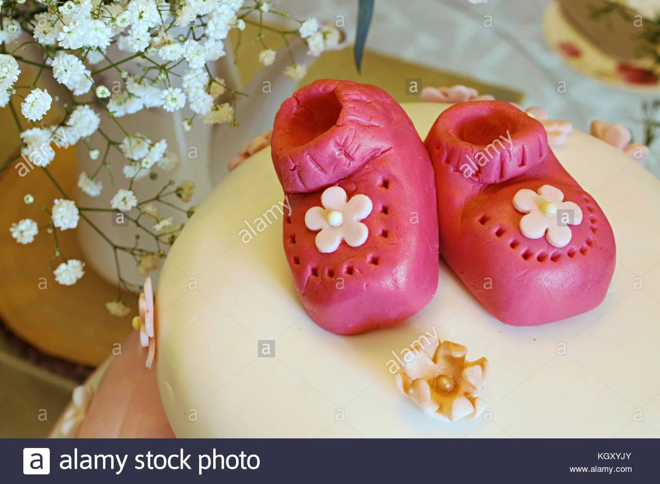 Pink Marzipan Baby Booties On A Baby Shower Cake For A Girl To Stock Pink Marzipan Baby Booties On A Baby Shower Cake For A Girl To Celebrate KGXYJY Stock Photo Pink Marzipan Baby Booties On A Baby Shower Cake For A Girl To Celebrate 165320259html