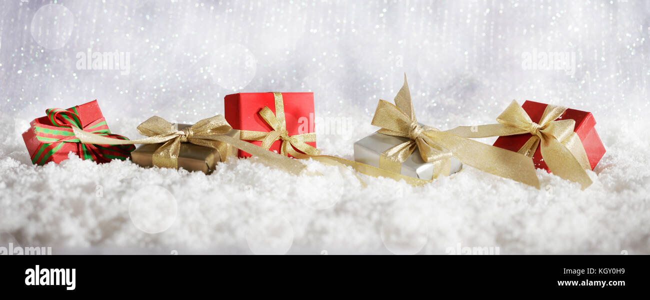 Red Christmas gift boxes on abstract cold winter background with snow ...