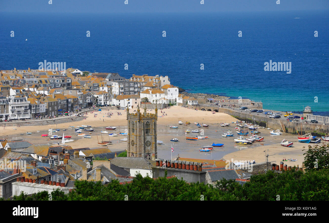 St Ives harbour from above,tides out with many beached boats. A bright
