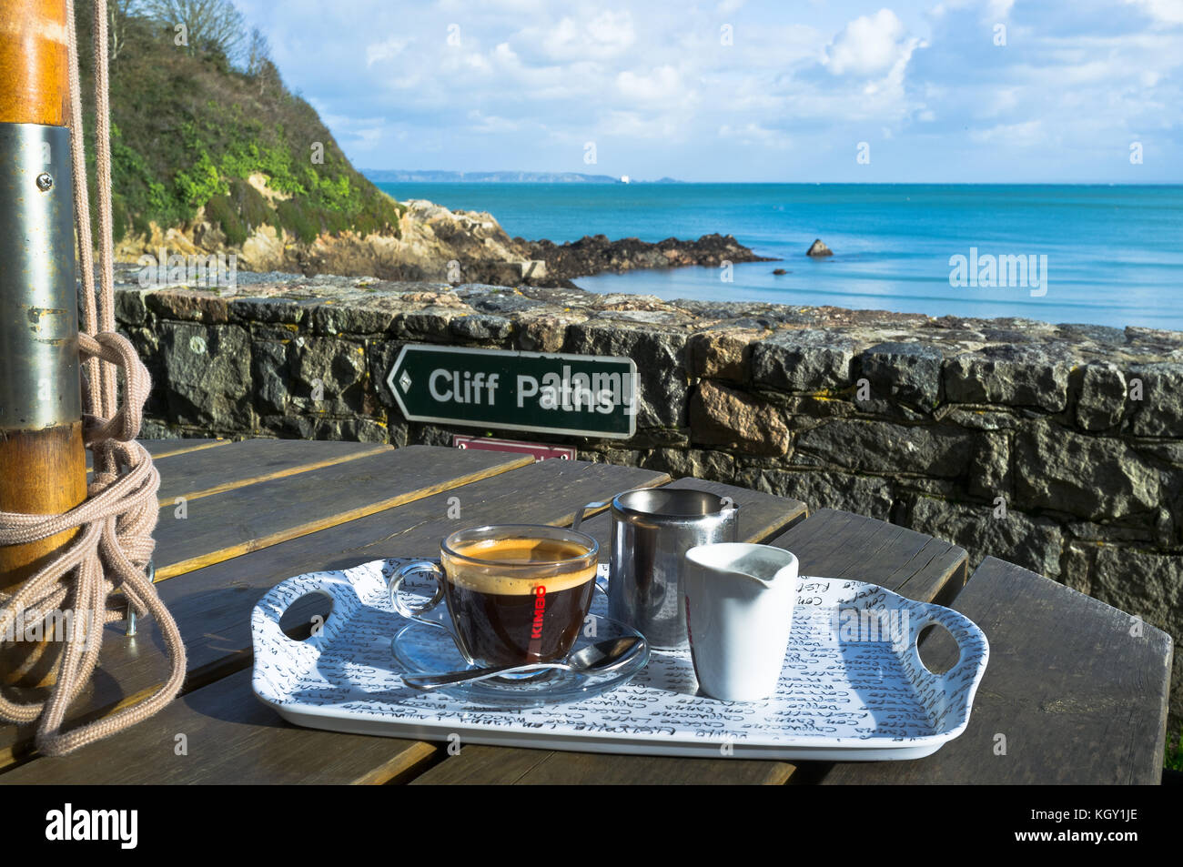 dh Coastal path FERMAIN BAY GUERNSEY Cafe outdoor coffee cup cliff path sign for coast footpath sea Stock Photo