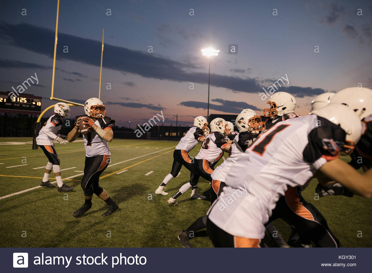 Quarterback throwing high school hires stock photography and images