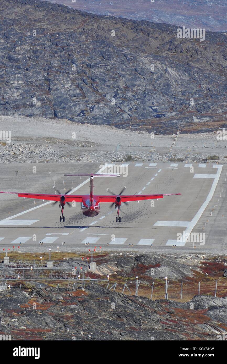 AIR GREENLAND DHC-8-200 LANDING ON ILULISSAT'S COMPACT RUNWAY. Stock Photo