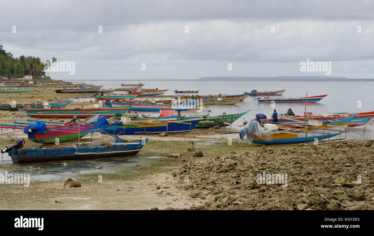 Colorful boats coming to biak from the surrounding Islands for a market visit, Papua Stock Photo