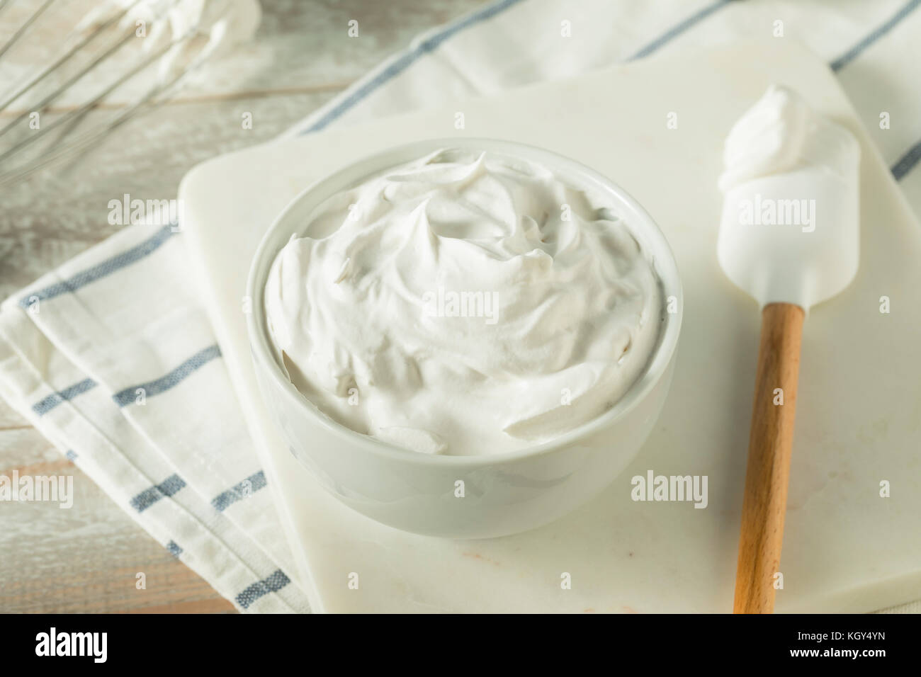 Sweet Homemade Vanilla Whipped Cream in a Bowl Stock Photo