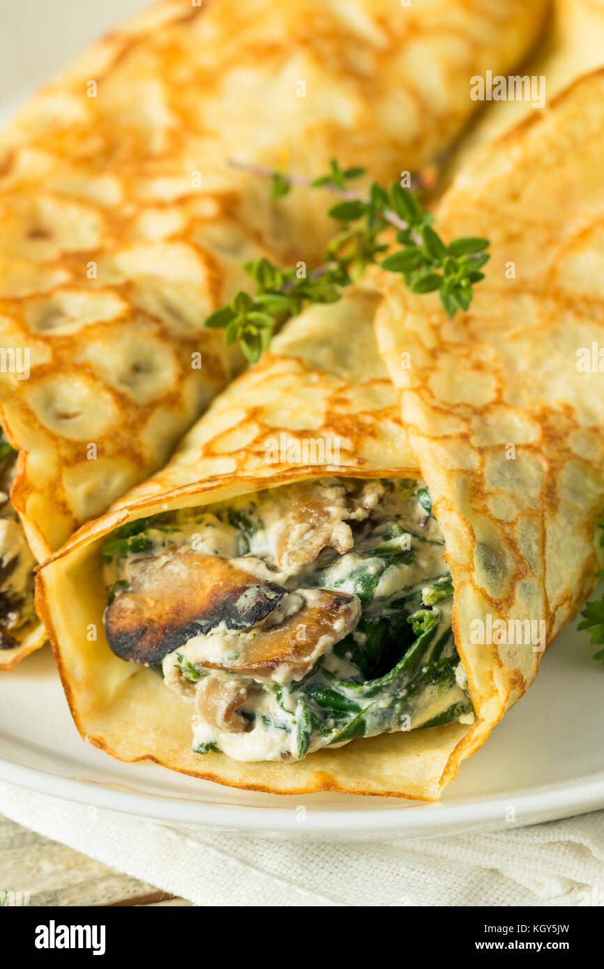 Savory Homemade Mushroom and Spinach Crepes with Cheese Stock Photo Alamy