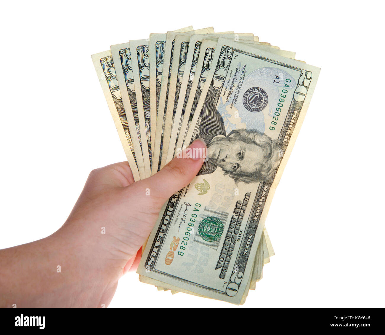 Young female hand holding several 20 dollar bills isolated on white background Stock Photo