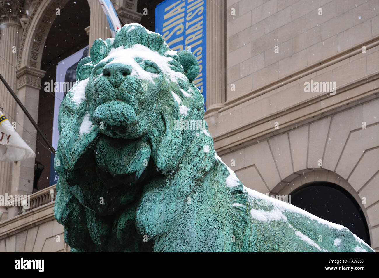 The iconic lions in front of the Art Institute of Chicago's Michigan Ave. entrance are covered with a light dusting of snow. Stock Photo