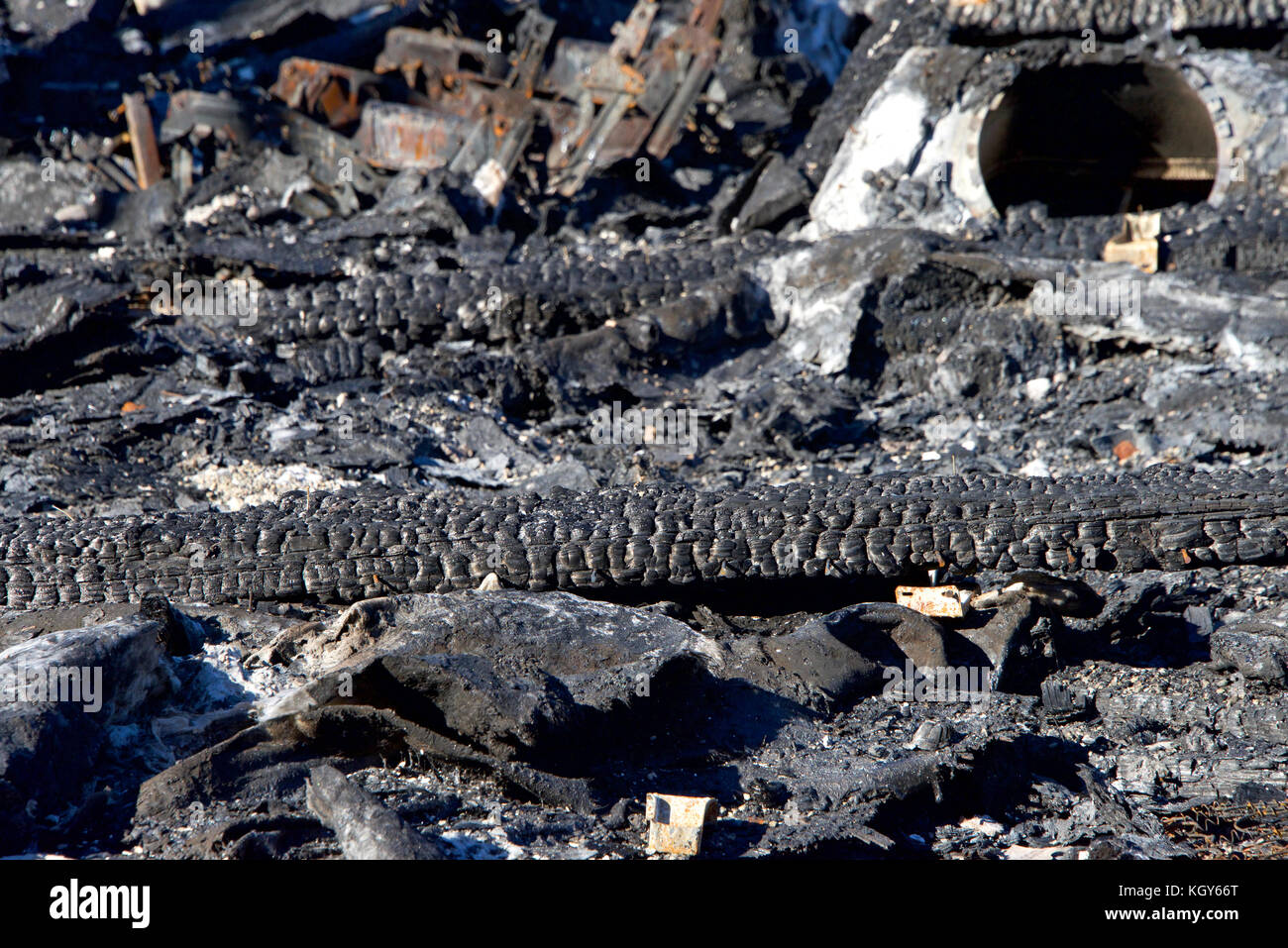 Roofing materials burned and fallen to the ground amongst the debri from napa valley wildfire. Structure burned in Santa Rosa California Stock Photo