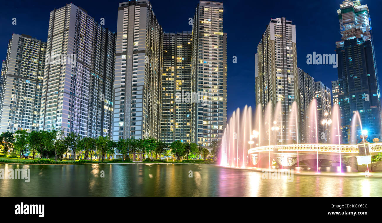 A state of the art fountain at night with colorful lights shimmering ...