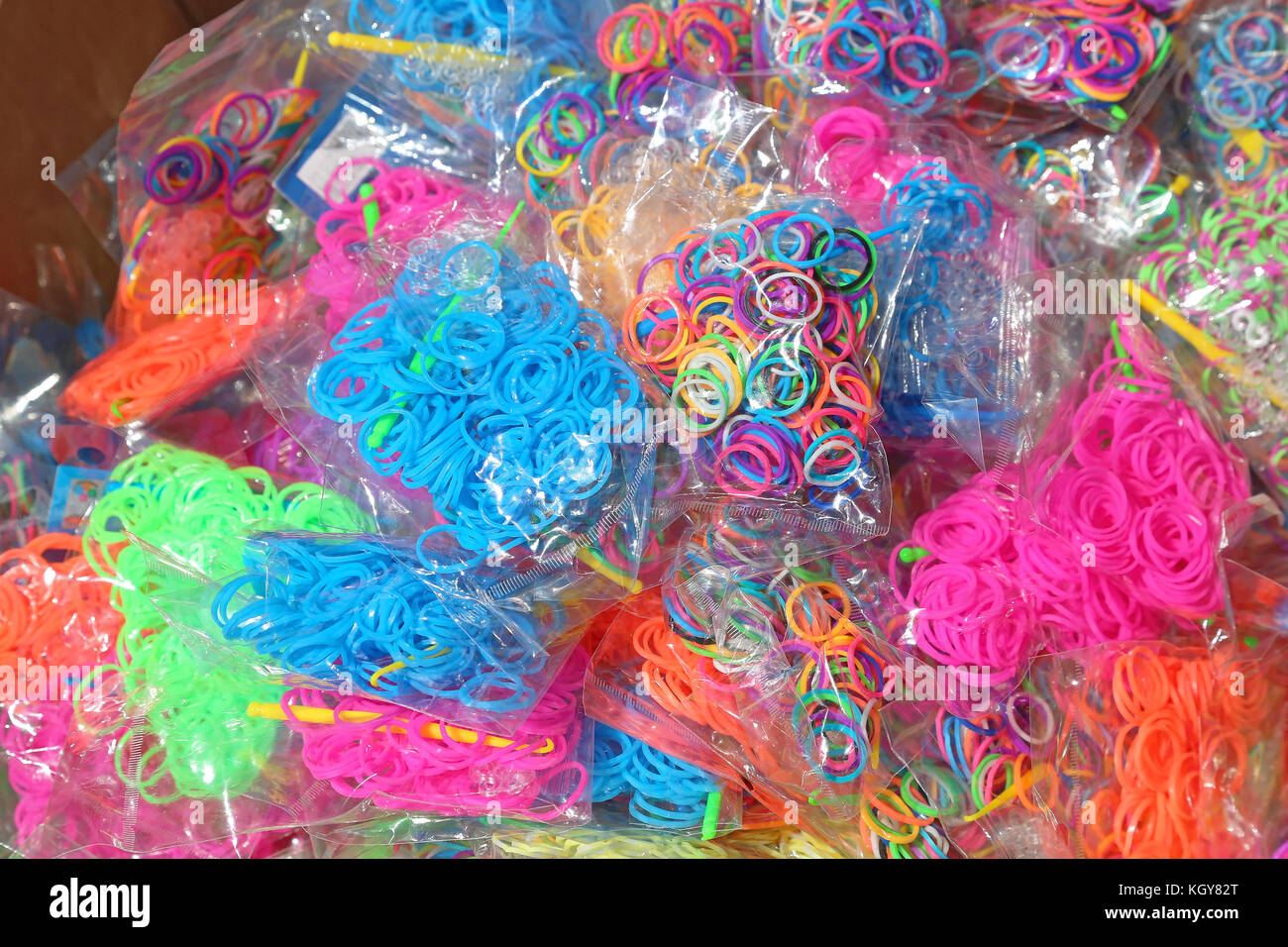 Pile of small round colorful rubber bands for making rainbow loom bracelets  isolated on white background Stock Photo - Alamy