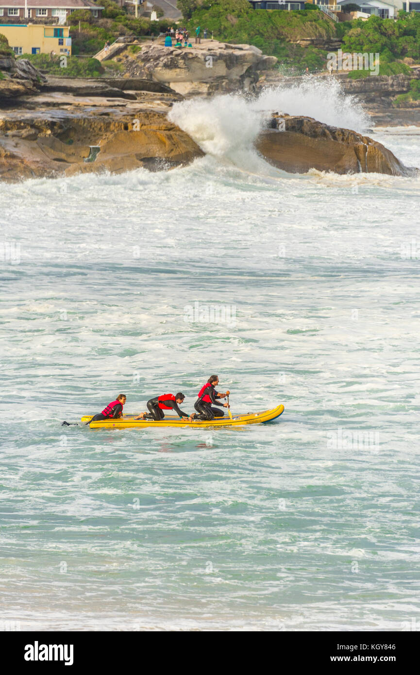 The rubber ducky crew heads out into wild surf conditions at Bronte Beach in Sydney, NSW, Australia Stock Photo