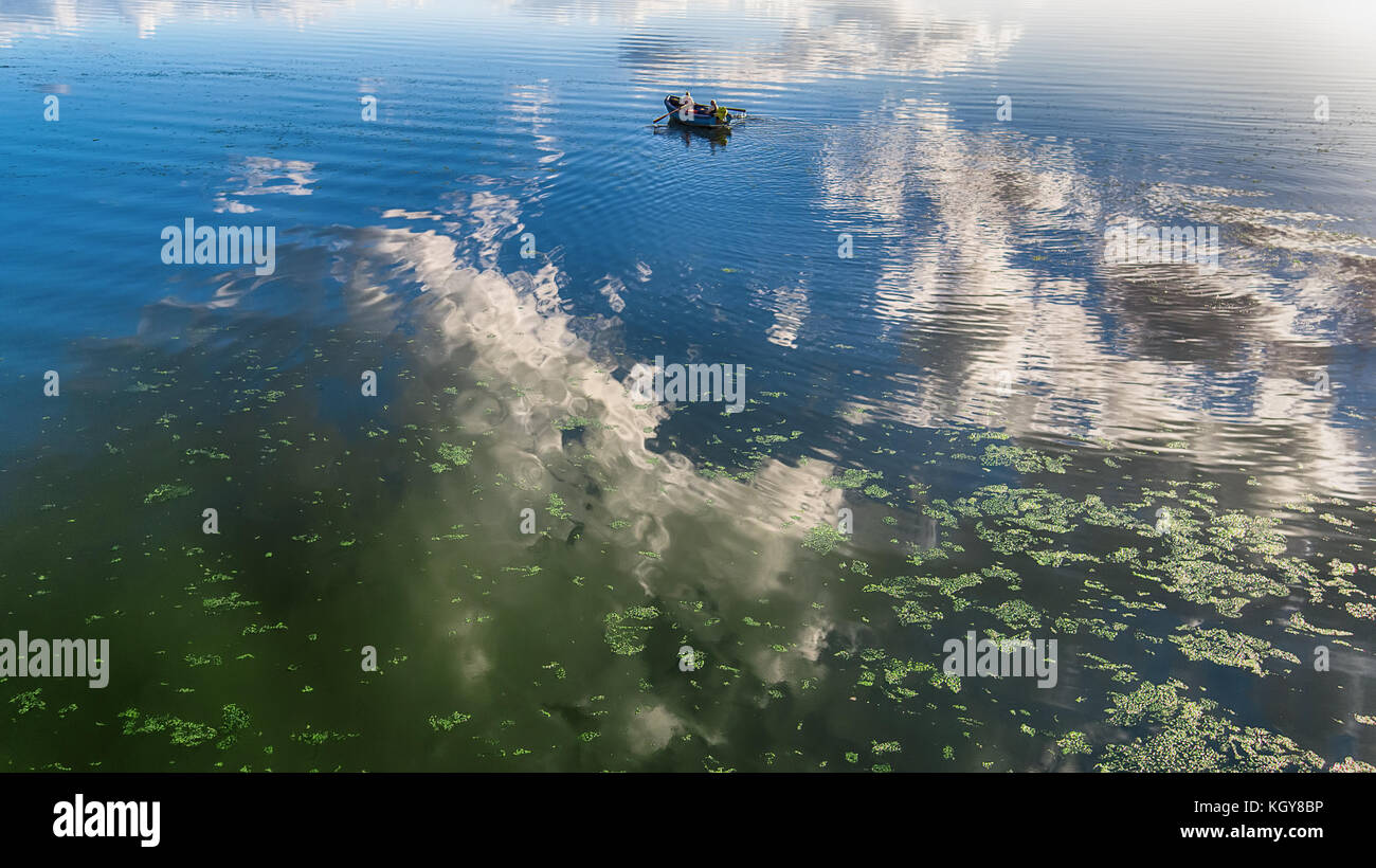Aerial view of a wooden boat in the lake Stock Photo - Alamy