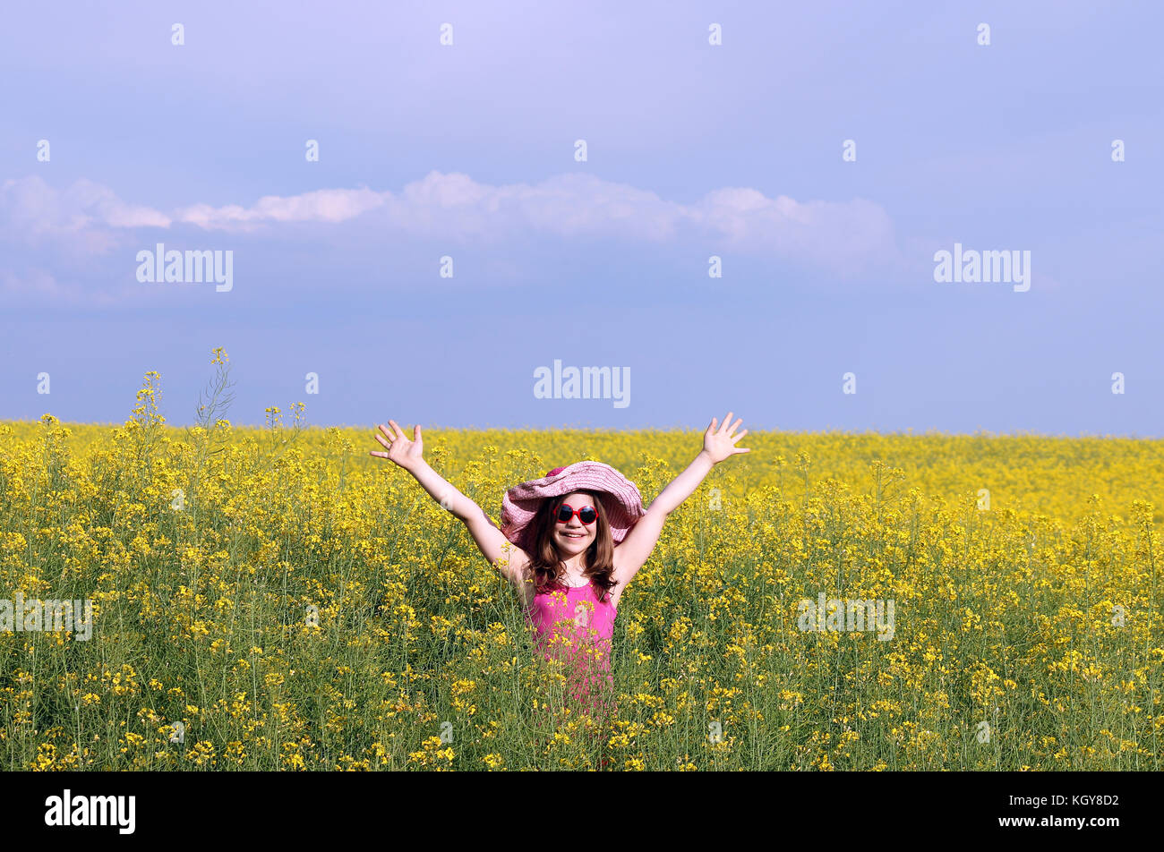 happy little girl on field summer season Stock Photo - Alamy