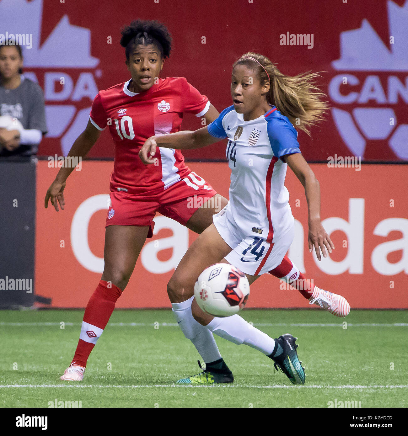 Vancouver, Canada. 09th Nov, 2017. Team Canada Ashley Lawrence (10) and  Team USA Casey Short (14) in game action during the women's soccer game  between Canada and USA at the BC Place