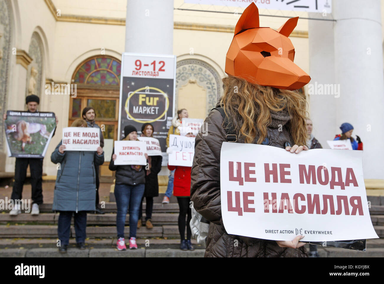 Kiev, Ukraine. 11th Nov, 2017. An activist wearing an animal mask holds ...