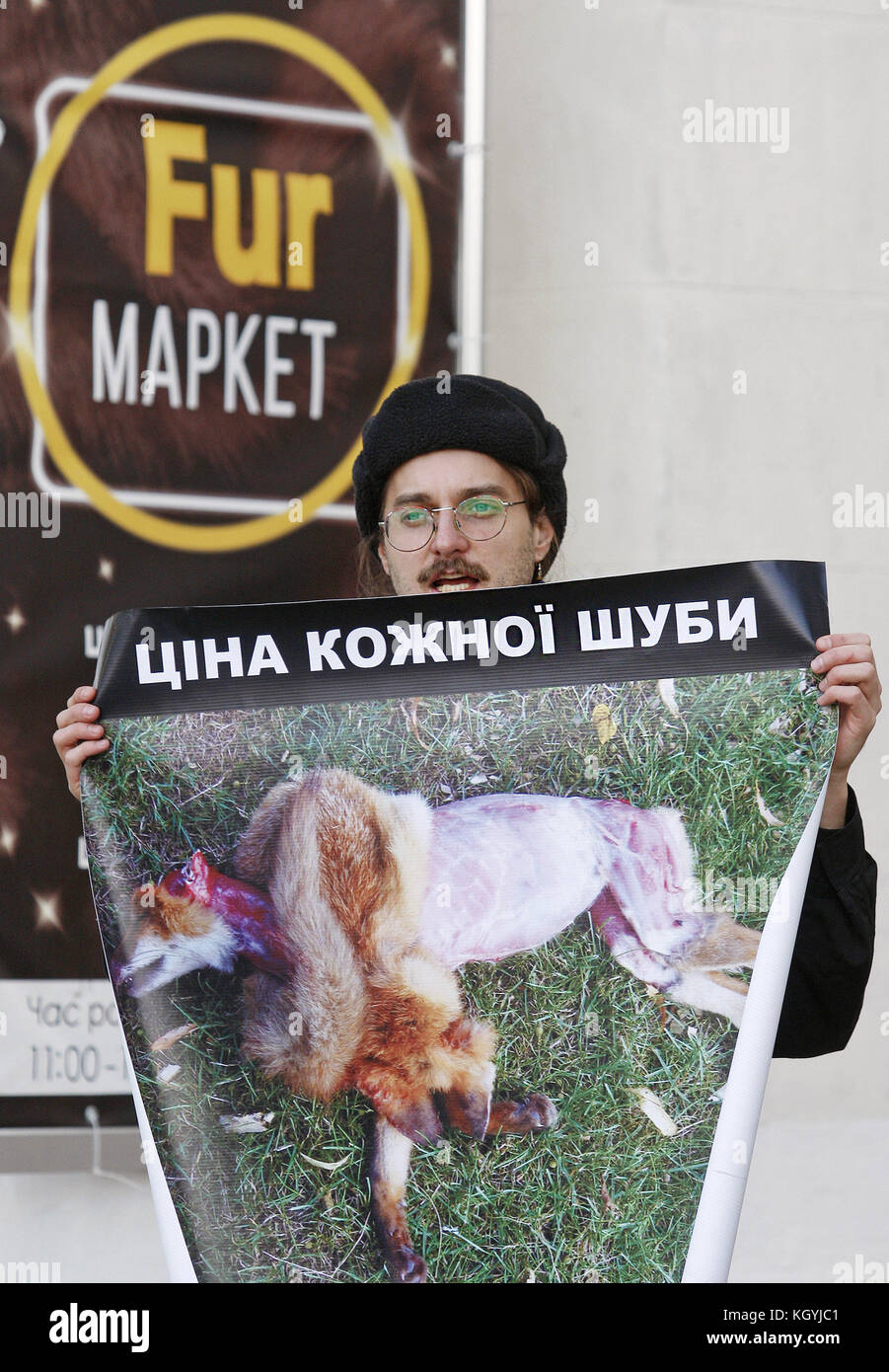 Kiev, Ukraine. 11th Nov, 2017. An activist holds a poster reading like ''The price of each fur