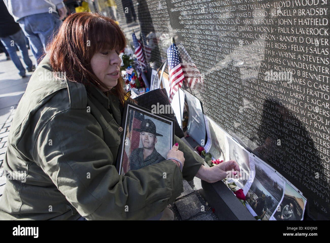 Washington, USA. 11th Nov, 2017. KRYSTEEN WESCOTT, of Long Island, New York, holds a photo of her father, Sargent 1st Class, Robert Wescott Jr., who was killed in action in Vietnam in 1969, at the Vietnam Veterans Memorial on the National Mall in Washington, D.C. on Veterans Day, November 11th, 2017. Credit: ZUMA Press, Inc./Alamy Live News Stock Photo