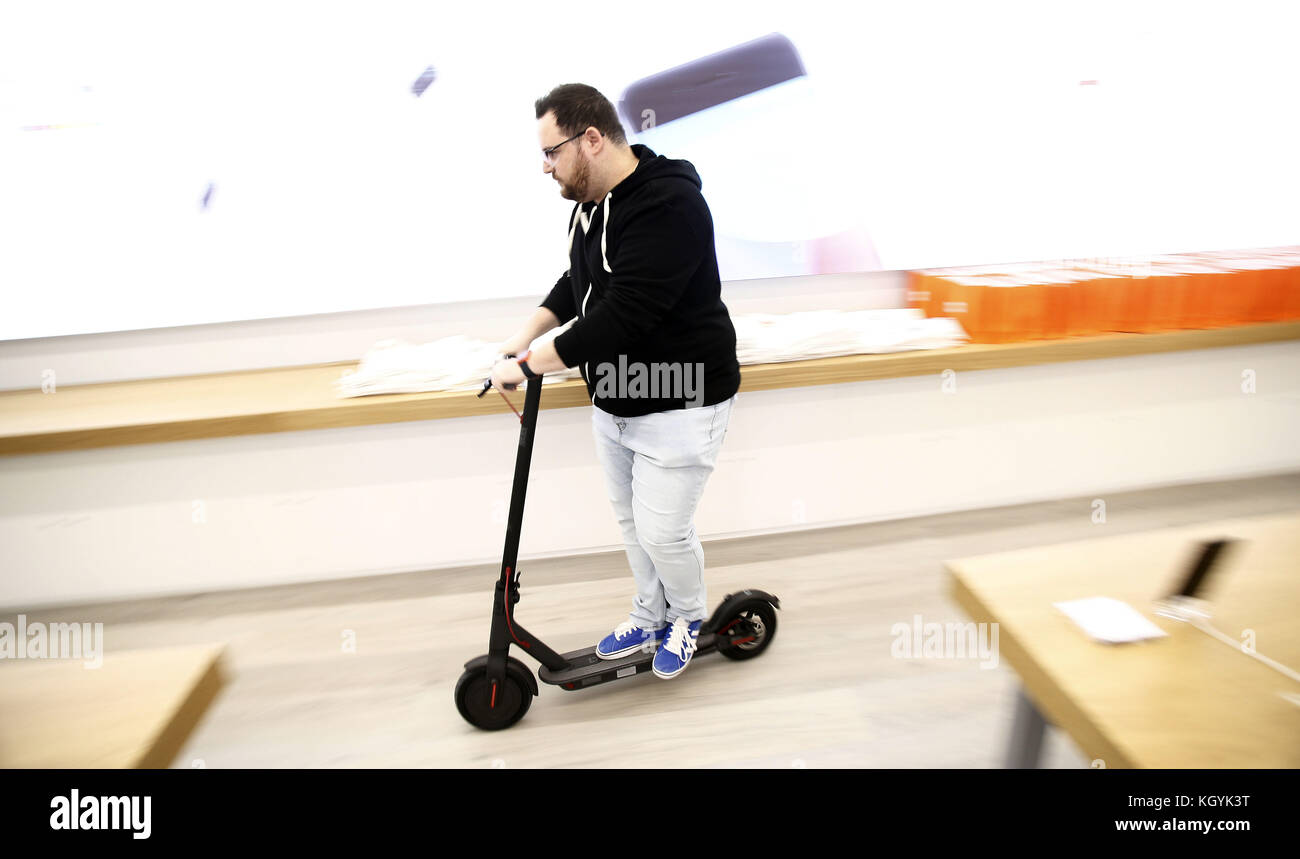 Arroyomolinos, Madrid, Spain. 11th Nov, 2017. A well-known Spanish YouTuber test the electric scooter produced by Xiaomi.The company Xiaomi, inaugurates its first store in Spain. Spain, is the second European country in which the Chinese giant disembarks after Greece.With two stores in Madrid, Xiaomi will bring a total of 40 products of the brand and launch the Spanish website for sale online. Fans seen queuing at the first store as early as 3 hours before the offical opening. The first client received the honor of cutting the opening ribbon and bought an electric scooter. (Credit Image Stock Photo
