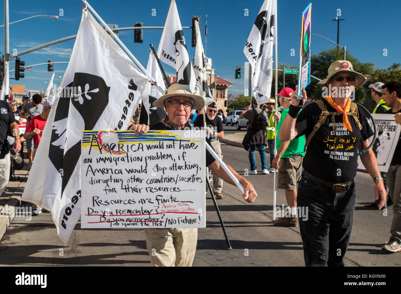 Nogales, Arizona USA and Nogales, Sonora Mexico - 11 November 2017 - On Veterans Day, members of Veterans for Peace led a march and rally on both sides of the U.S.-Mexico border fence to protest the separation of immigrant families, U.S. policies that make it hard for refugees fleeing repression to enter the United States, and the deportation of veterans who have served in the U.S. military. The events were organized by the School of the Americas Watch, a group of religious and community activists. Stock Photo