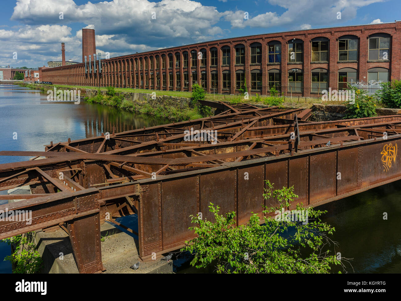 View of a mill building along a canal in Lawrence Massachusetts. Stock Photo