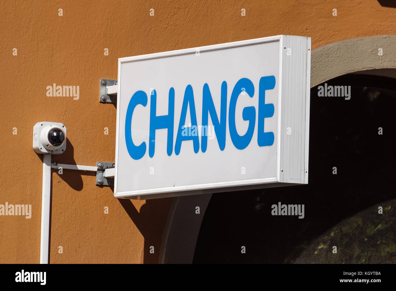 Money exchange sign at wall in the city . Stock Photo