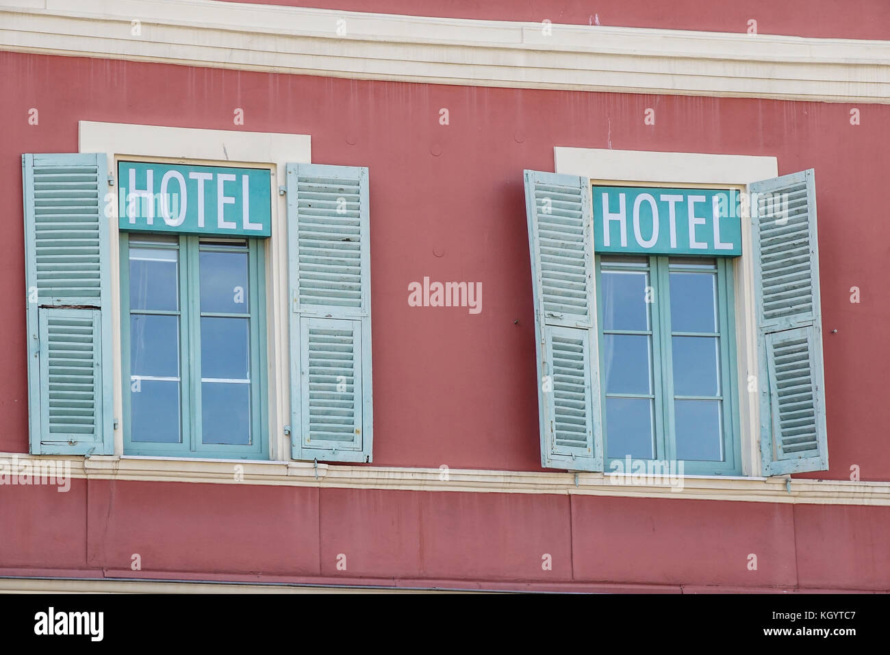 hotel signboard in a building facade with windows Stock Photo - Alamy