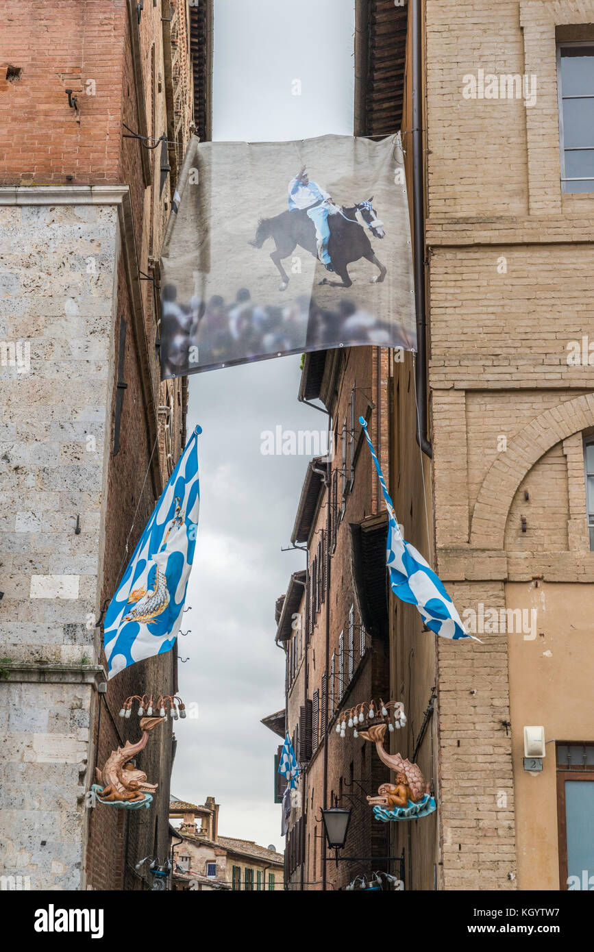 A contrada is a district, or a ward, within an Italian city of Siena. This represents 'Onda' whose residents were traditionally carpenters Stock Photo