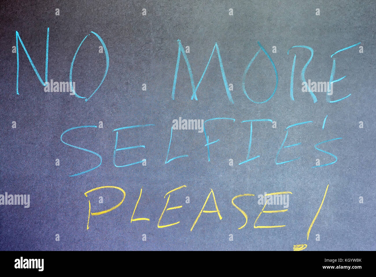 Phrase No More Selfie's Please! written on chalkboard background. Stock Photo