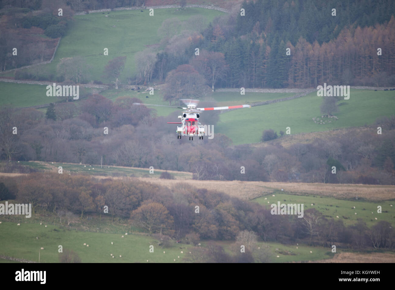 HM Coastguard Search & Rescue Helicopter Rescue 936, conducting low flying training in Snowdonia. Stock Photo