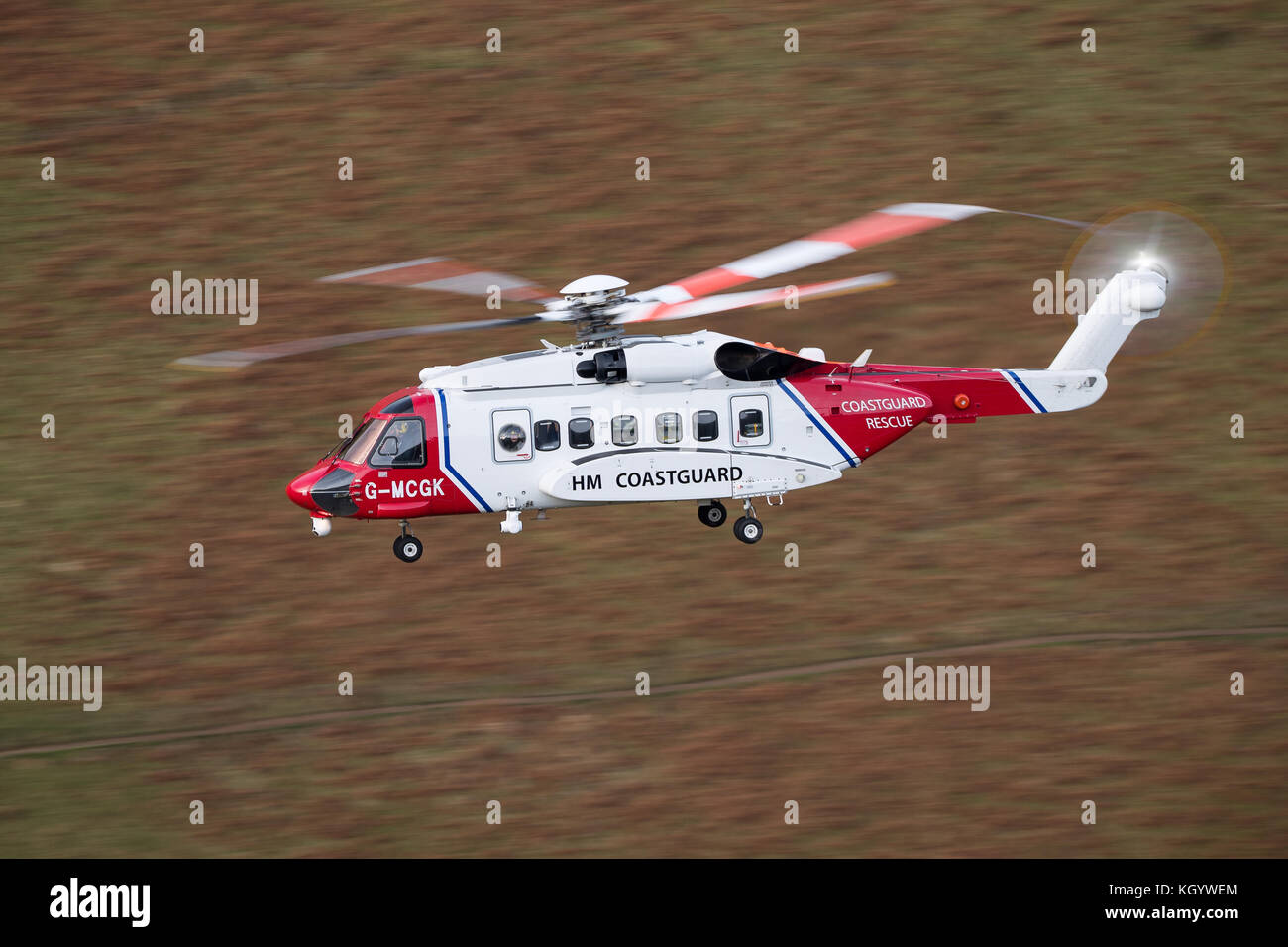 HM Coastguard Search & Rescue Helicopter Rescue 936, conducting low flying training in Snowdonia. Stock Photo