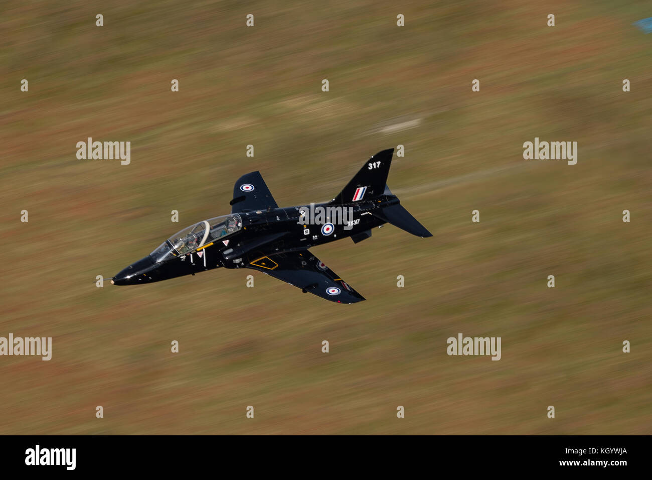 Royal Air Force Hawk trainer aircraft conducting low flying trainin in Snowdonia. Stock Photo