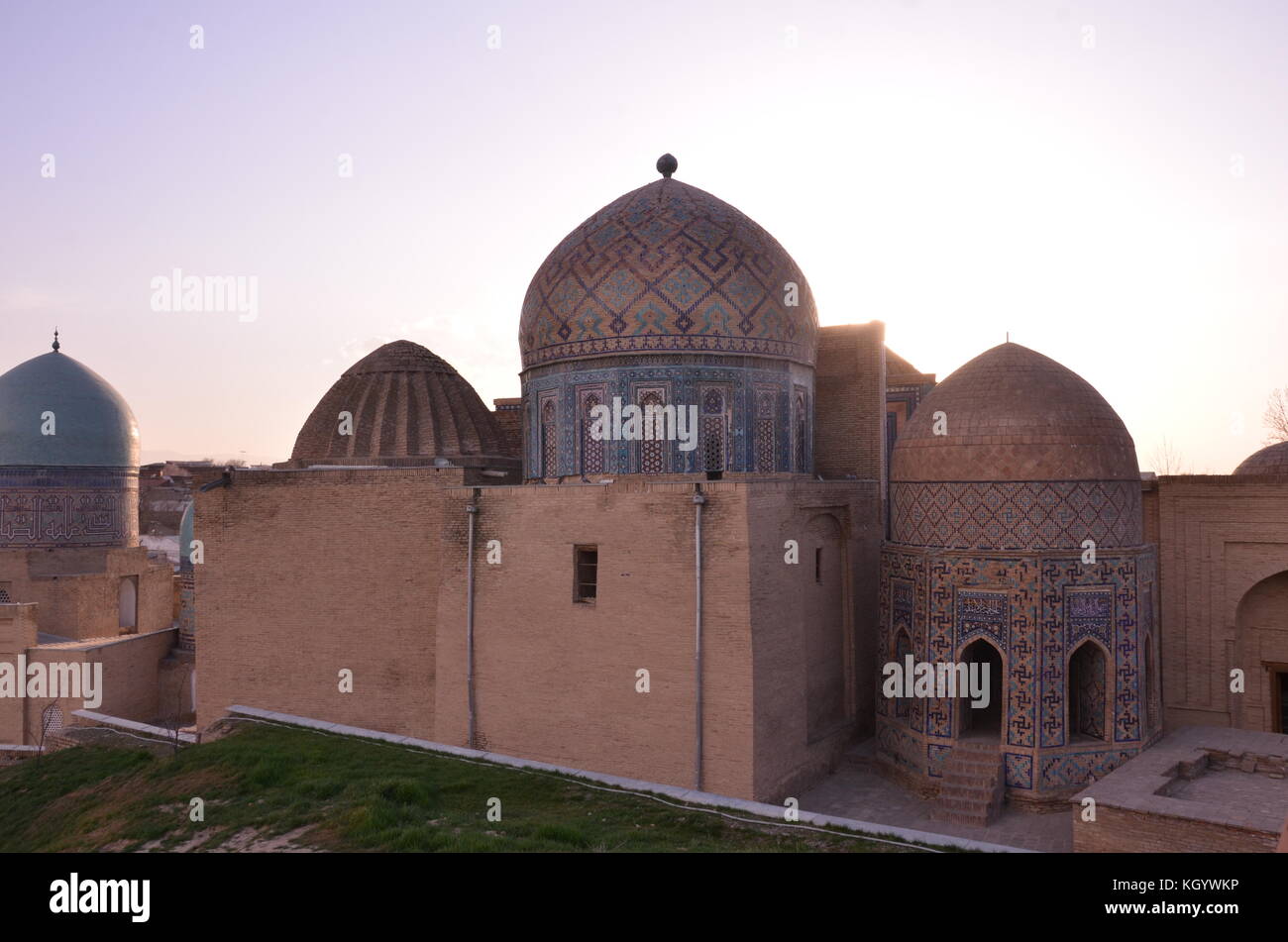 Shah-i-Zinda Necroplis with muslim cemetery with mausoleums, tombs and graves during sunset. Stock Photo