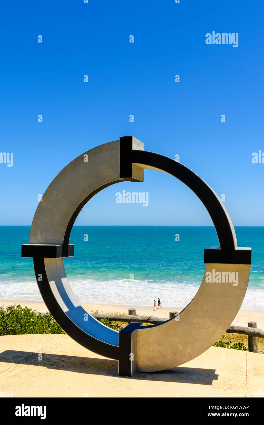 People walking along North Cottesloe beach, as seen through the Centrefold sculpture, Cottesloe, Perth, Western Australia Stock Photo