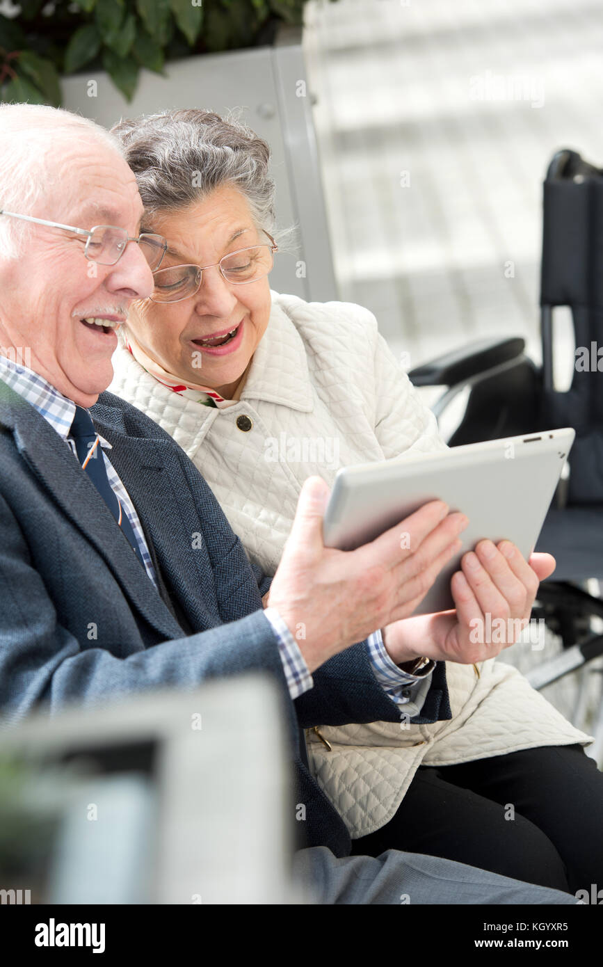 happy senior couple with tablet computer Stock Photo