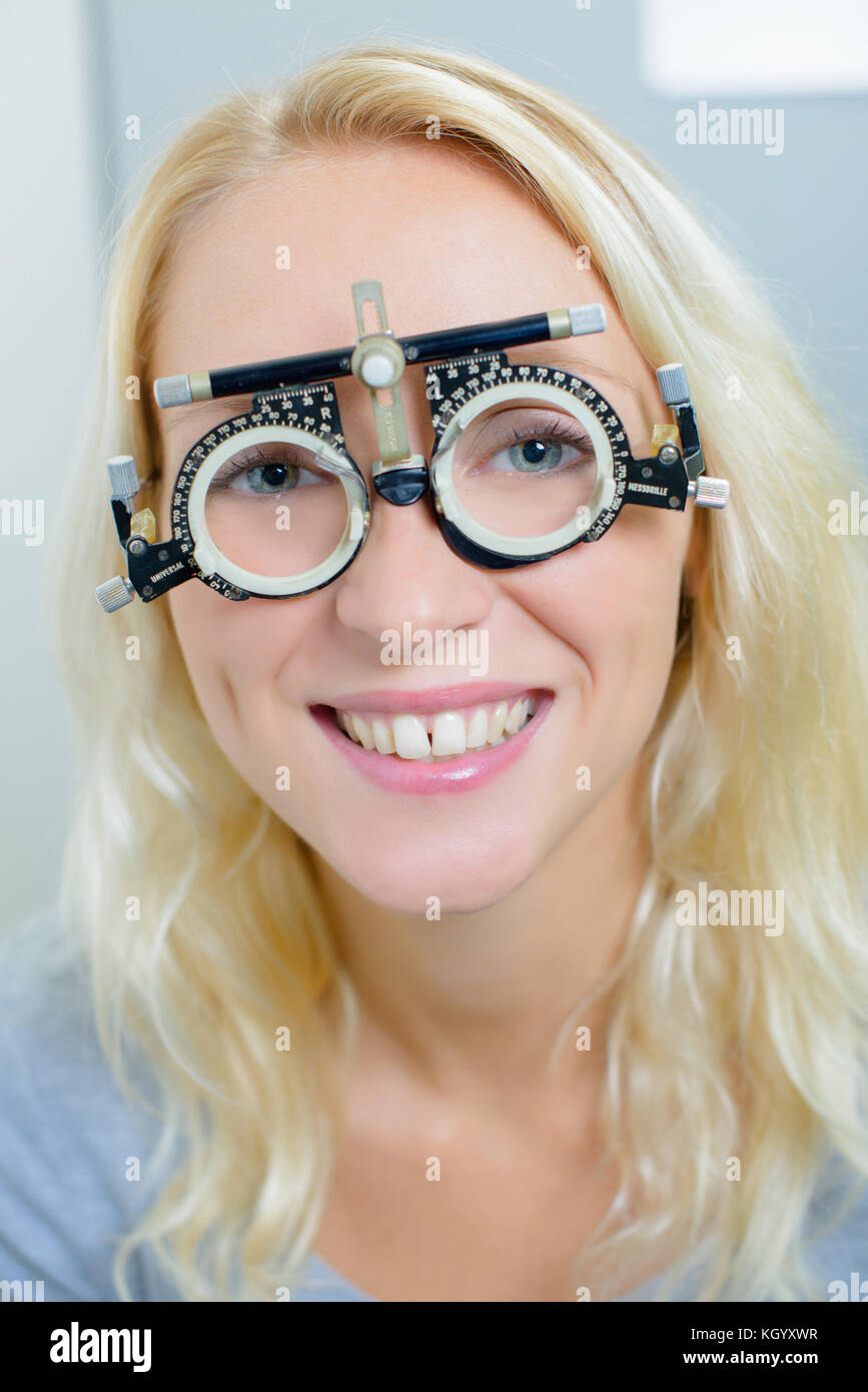 lady wearing opticians testing glasses Stock Photo