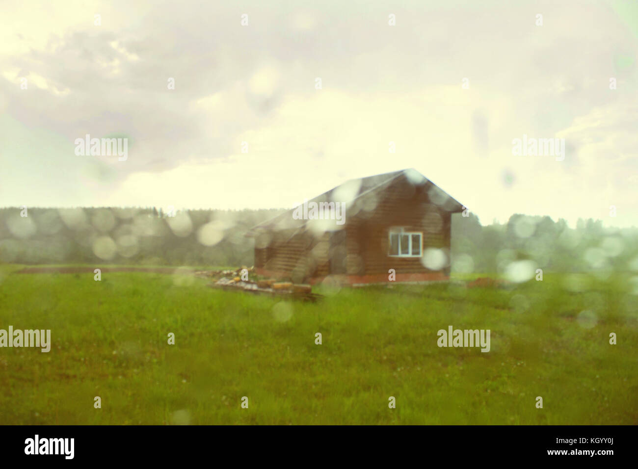 An old house on the prairie. rain. blur Stock Photo - Alamy