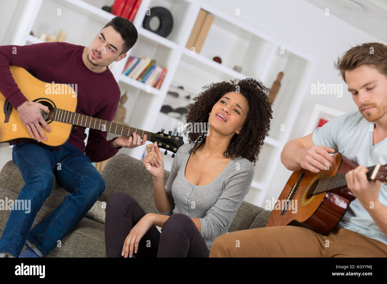 Group teenagers listening music hi-res stock photography and images - Alamy