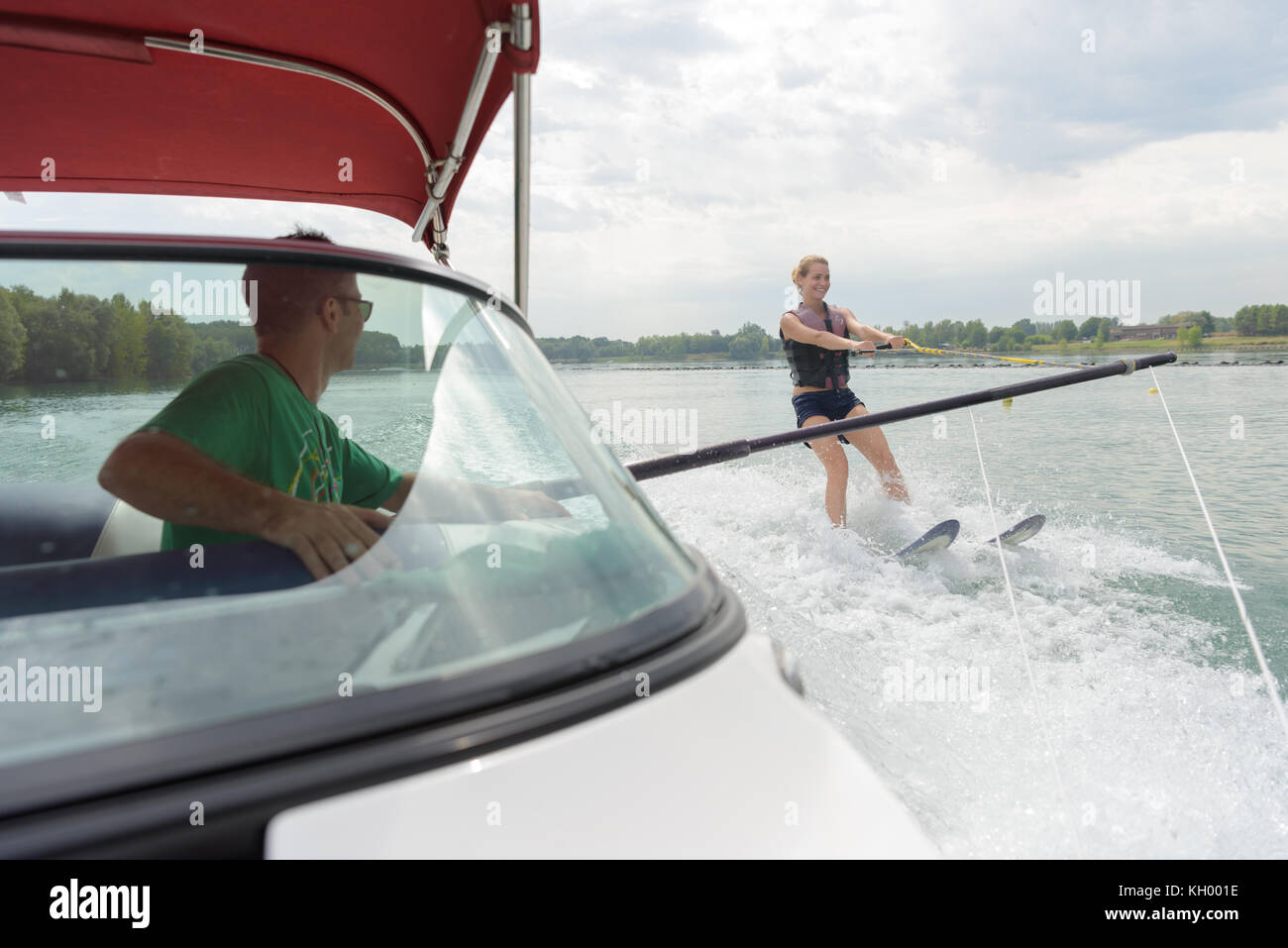 boy learning waterski with instructor on a boat Stock Photo Alamy